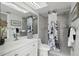 Bright bathroom boasts modern vanity, shower, and updated fixtures at 7698 Cardiff Ct, St Petersburg, FL 33709
