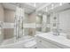 Clean bathroom includes a bathtub, shower, and updated vanity at 7698 Cardiff Ct, St Petersburg, FL 33709