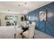 Dining room features a round glass table, four chairs and a chandelier at 7698 Cardiff Ct, St Petersburg, FL 33709