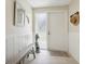 Bright entryway with tiled floor, bench, and coat rack at 7698 Cardiff Ct, St Petersburg, FL 33709