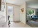 Open entryway, featuring a view into the living room at 7698 Cardiff Ct, St Petersburg, FL 33709