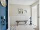 Bright and airy entryway with a built-in bench and coastal decor at 7698 Cardiff Ct, St Petersburg, FL 33709