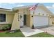House exterior showcasing a white front door and attached garage at 7698 Cardiff Ct, St Petersburg, FL 33709