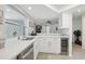 Modern kitchen with stainless steel appliances and white cabinets at 7698 Cardiff Ct, St Petersburg, FL 33709