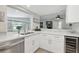 Modern kitchen with white cabinets and quartz countertops at 7698 Cardiff Ct, St Petersburg, FL 33709