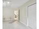 Laundry room with tile floor and access to kitchen at 7698 Cardiff Ct, St Petersburg, FL 33709