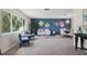 Living room features a stylish blue accent wall and comfortable seating at 7698 Cardiff Ct, St Petersburg, FL 33709