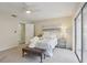 Spacious bedroom with a comfortable bed and sliding glass doors leading to a patio at 7698 Cardiff Ct, St Petersburg, FL 33709