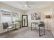 Home office with a desk, chairs, and a view of backyard at 7698 Cardiff Ct, St Petersburg, FL 33709