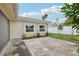 Back patio with flagstone, landscaping and exterior access at 7698 Cardiff Ct, St Petersburg, FL 33709