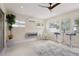 Relaxing sunroom with fireplace, seating area, and view of backyard at 7698 Cardiff Ct, St Petersburg, FL 33709