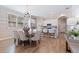 Elegant dining room with modern chandelier and hardwood floors at 833 51St N Ave, St Petersburg, FL 33703