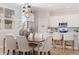 Bright dining room features a chandelier and hardwood floors at 833 51St N Ave, St Petersburg, FL 33703