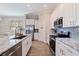 Modern kitchen with stainless steel appliances and marble countertops at 833 51St N Ave, St Petersburg, FL 33703