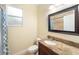 Bathroom with granite countertop and shower at 8332A Jackson Springs Rd, Tampa, FL 33615