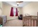 Bedroom with crib, armchair, and dresser at 8332A Jackson Springs Rd, Tampa, FL 33615