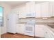 White kitchen with appliances and light countertops at 8951 Walnut Gable Ct, Riverview, FL 33578