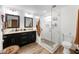 Modern bathroom with double vanity, glass shower, and granite counters at 902 W Alsobrook St, Plant City, FL 33563