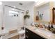 Updated bathroom with white subway tile, granite vanity, and a bathtub at 902 W Alsobrook St, Plant City, FL 33563