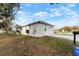 View of the home's side, showcasing the driveway and yard at 902 W Alsobrook St, Plant City, FL 33563