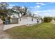 Side view showcasing the home's garage and landscaping at 902 W Alsobrook St, Plant City, FL 33563