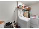 Bright laundry room with washer, dryer, and ample shelving at 902 W Alsobrook St, Plant City, FL 33563