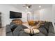 Spacious living room with comfortable sectional sofa and large TV at 902 W Alsobrook St, Plant City, FL 33563