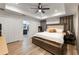 Spacious bedroom with a king-size bed, ensuite bath access at 902 W Alsobrook St, Plant City, FL 33563