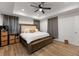 King-size bed and ensuite bathroom access at 902 W Alsobrook St, Plant City, FL 33563