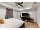 Main bedroom with large TV and ample closet space at 902 W Alsobrook St, Plant City, FL 33563