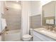Clean bathroom with a bathtub, shower, and a single vanity at 9409 Barnacle Ln, Parrish, FL 34219