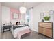 Charming bedroom with pink accent wall and a comfy bed at 9409 Barnacle Ln, Parrish, FL 34219