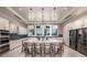 Large kitchen with white cabinets, island, and stainless steel appliances at 9409 Barnacle Ln, Parrish, FL 34219
