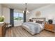 Spacious main bedroom with king-size bed, wood dresser, and a neutral color scheme at 9409 Barnacle Ln, Parrish, FL 34219