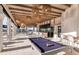 Outdoor poolside bar with billiard table and comfortable seating at 9413 Barnacle Ln, Parrish, FL 34219