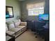 Home office with a comfortable sofa and workspace setup at 1736 Thomas Dr, Clearwater, FL 33759