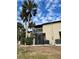 Private back patio with screen enclosure and AC unit at 1028 Apollo Beach Blvd # 11, Apollo Beach, FL 33572