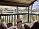Relaxing screened balcony overlooking the water, featuring wicker furniture at 1028 Apollo Beach Blvd # 11, Apollo Beach, FL 33572