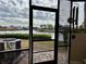 View from screened patio showing water access and boats at 1028 Apollo Beach Blvd # 11, Apollo Beach, FL 33572