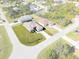Aerial view of a house on a corner lot with a large front yard and a pool at 112 Sidney Ct, Rotonda West, FL 33947