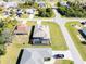 Aerial view of a house with pool and fenced backyard, located on a corner lot at 112 Sidney Ct, Rotonda West, FL 33947