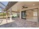 Spacious covered patio with sliding doors leading to the interior at 112 Sidney Ct, Rotonda West, FL 33947