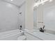 Modern bathroom with soaking tub, vanity, and updated fixtures at 112 Sidney Ct, Rotonda West, FL 33947
