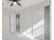 Bright bedroom with white closet doors and marble-look flooring at 112 Sidney Ct, Rotonda West, FL 33947