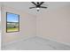 Bright bedroom featuring neutral walls and marble-look floors at 112 Sidney Ct, Rotonda West, FL 33947