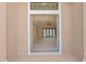 Open floor plan view from entryway showcasing the living room and backyard access at 112 Sidney Ct, Rotonda West, FL 33947