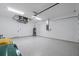 Clean and spacious garage with epoxy flooring and extra storage at 112 Sidney Ct, Rotonda West, FL 33947