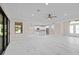 Open concept living area with kitchen, marble floors, and sliding glass doors at 112 Sidney Ct, Rotonda West, FL 33947