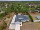 Aerial view showing the house and its surrounding wooded area at 11320 Gallinule Ave, Weeki Wachee, FL 34613