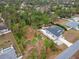 Aerial view of the house and surrounding lots with mature trees at 11320 Gallinule Ave, Weeki Wachee, FL 34613